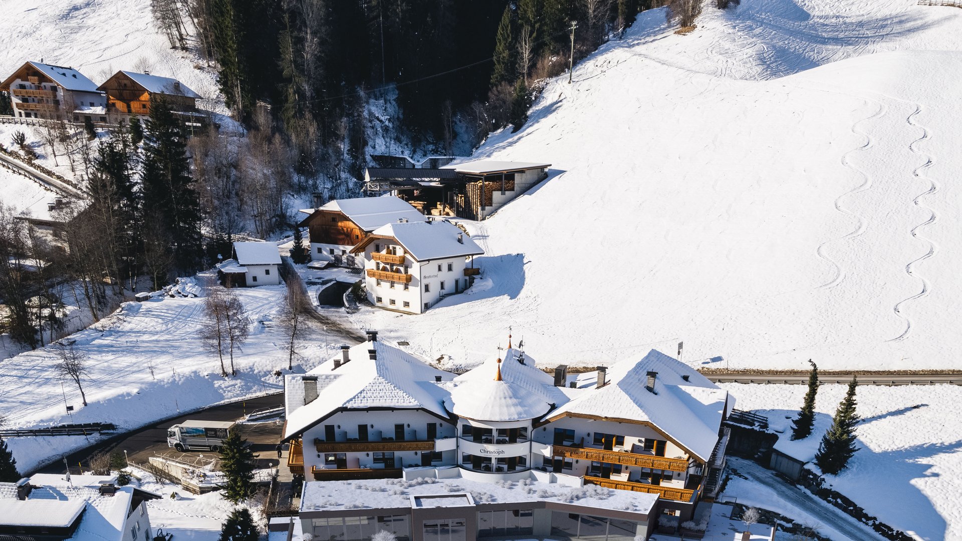 Unforgettable skiing holiday on Plan de Corones/Kronplatz Aerial view of a snow-covered mountain resort