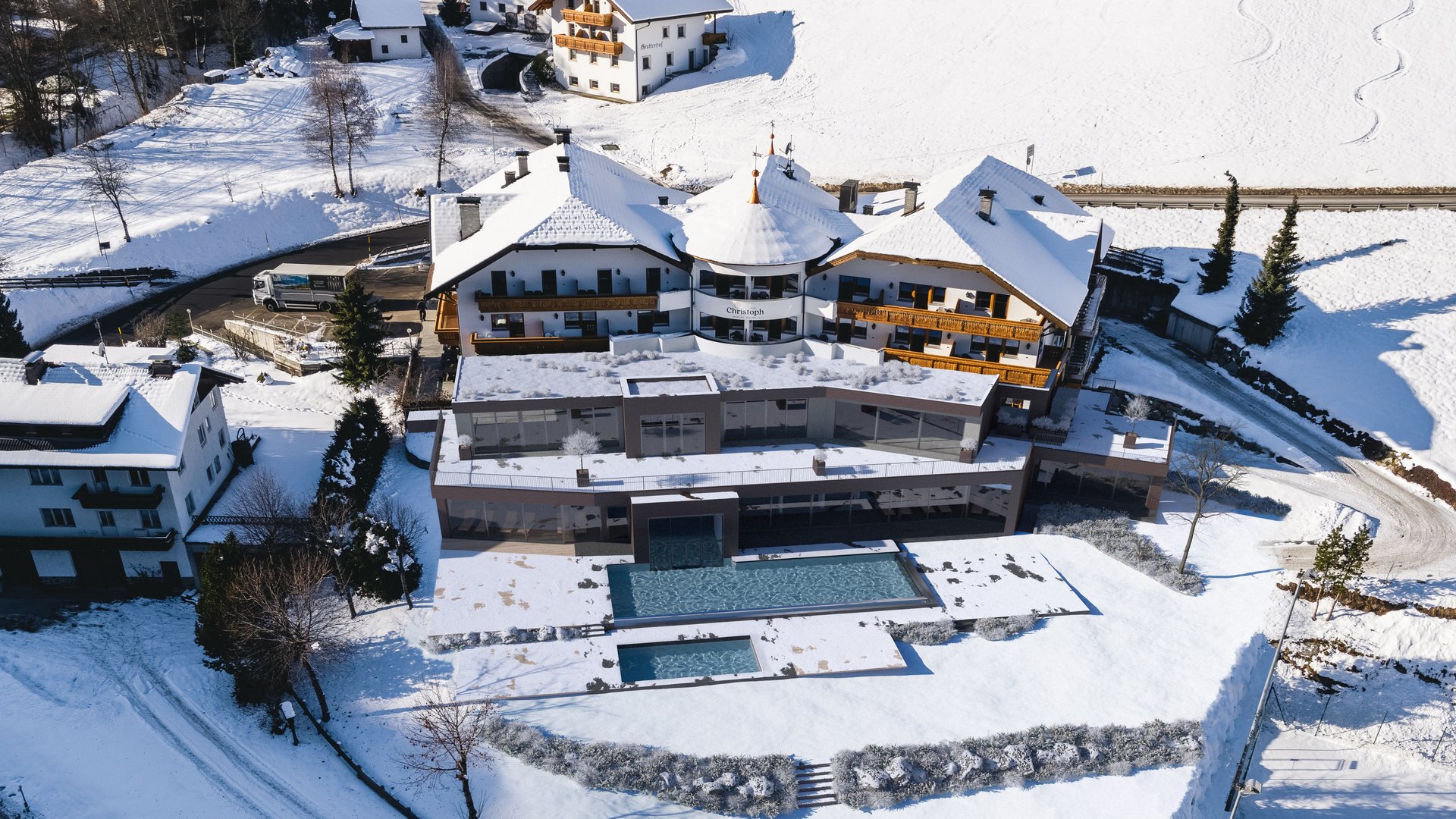 Unforgettable skiing holiday on Plan de Corones/Kronplatz Aerial view of a snow-covered mountain resort