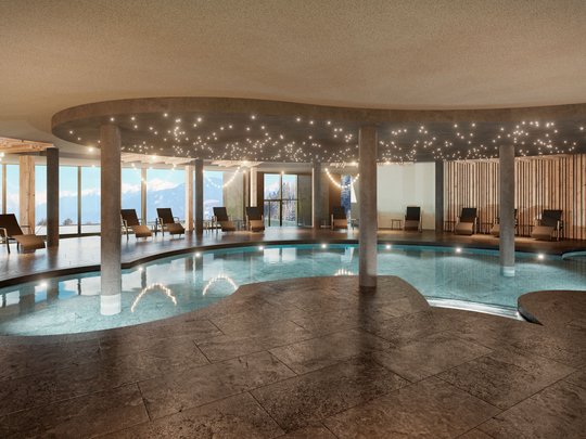 Le novità del nostro hotel a 4 stelle tra le Dolomiti Interno di una piscina benessere moderna con sedie a sdraio e luce a soffitto a stelle